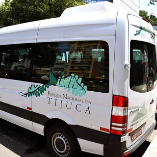 A white official Paineiras-Corcovado van marked Parque Nacional da Tijuca