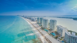 Cancún’s hotel zone above the white sand and turquoise Caribbean